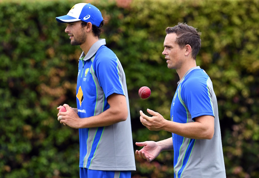 Ashton Agar and Steve O'Keefe prepare to bowl in the nets in Sydney on Monday.