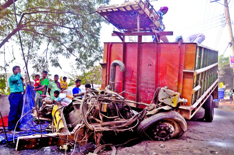 A carrier of goods-laden truck gave in completely due to overloading of goods in city's Matuail area on Monday.