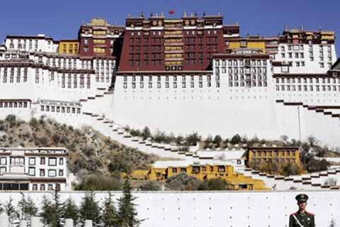 A paramilitary policeman stands guard in front of the Potala Palace in Lhasa, Tibet Autonomous Region, China.