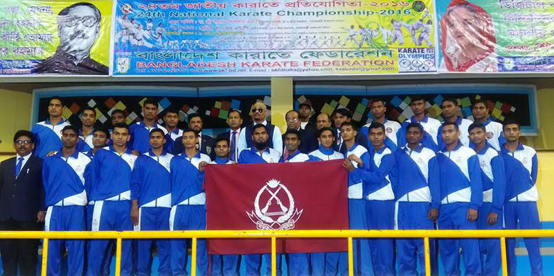 Karatekas of Border Guard Bangladesh and Deputy Minister for Youth and Sports Arif Khan Joy and the guest and officials of Bangladesh Karate Federation pose for a photograph on the opening day of the two-day long 24th National Karate Competition at the Sh