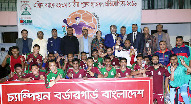 Bangladesh Border Guard, the champions of the EXIM Bank 26th National (Men's) Handball Championship with the guest and the officials of Bangladesh Handball Federation pose for a photo session at the Shaheed (Captain) M Mansur Ali National Handball Stadiu