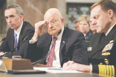 Director of National Intelligence James Clapper (centre) testifies before the Senate Armed Services Committee on Thursday.