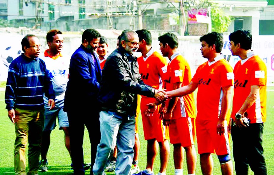 Former footballers of Bangladesh National Football team Hasanuzzaman Khan Bablu and Kazi Josimuddin Joshi being introduced with the participants of Kool-BSJA Media Cup Football at the BFF Artificial Turf on Friday.