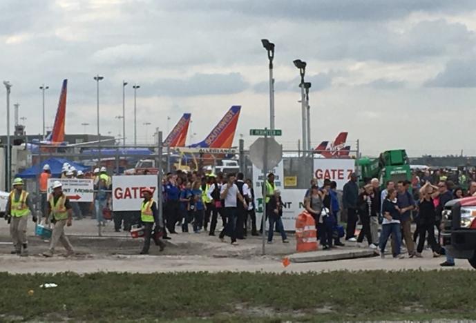 Travelers and airport workers are evacuated out of the terminal after airport shooting at Fort Lauderdale-Hollywood International Airport in Florida, U.S., January 6, 2017. REUTERSAndrew Innerarity