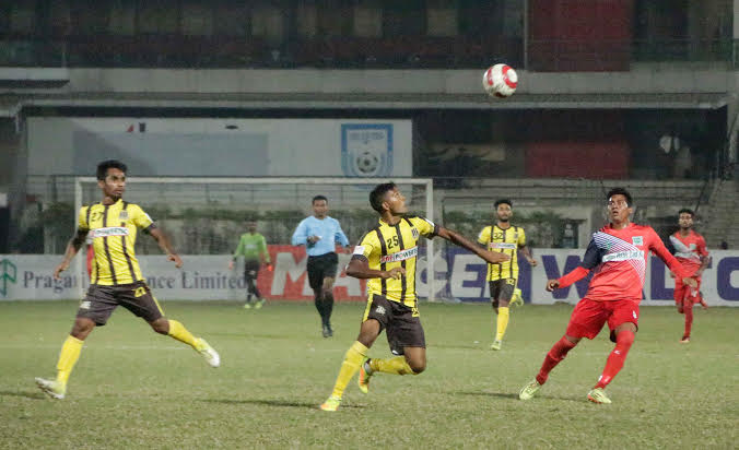 A moment of the match of the Marcel Bangladesh Championship League Football between Saif Sporting Club and Agrani Bank Limited Sports Club at the Bangabandhu National Stadium on Sunday. Saif Sporting Club won the match 1-0.