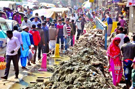 City dwellers continue to suffer as road digging goes on unabated in many areas for laying utility lines. A thoroughfare in Fakirapool area plunges into traffic chaos as bricks, mud and other materials remain uncared after the road digging. This photo wa