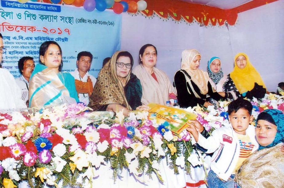 Hasina Mohiuddin, President, Chittagong City Mahila Awami League distributing books at the inaugural programme of Upokulio Karmojibi Mahila and Shishu Kalyan Sangstha as Chief Guest recently.