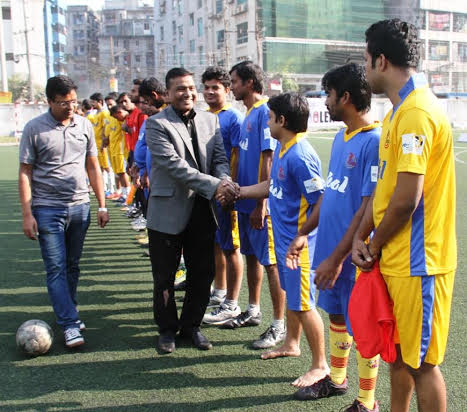 Former player of Bangladesh National Football team Khondker Raquibul Islam being introduced with the players of Kool-BSJA Media Cup football at the BFF Artificial Turf on Monday.