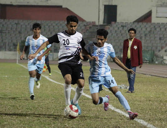 A scene from the match of the Marcel Bangladesh Championship League Football between Fakirerpool Youngmen's Club and Chittagong Mohammedan Sporting Club at the Bangabandhu National Stadium on Monday. Fakirerpool won the match 2-1. By virtue of yesterday"