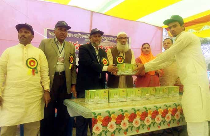 Principal Dr. Abdul Karim, Azizur Rahman Homeopathic College and Hospital distributing prizes among the winners of the annual sports and education tour of the institute on Saturday.