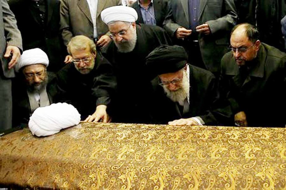 Iran's Supreme Leader Ayatollah Ali Khamenei and Iran's President Hassan Rouhani touch the coffin of former president Ali Akbar Hashemi Rafsanjani during his funeral ceremony in Tehran, Iran on Tuesday