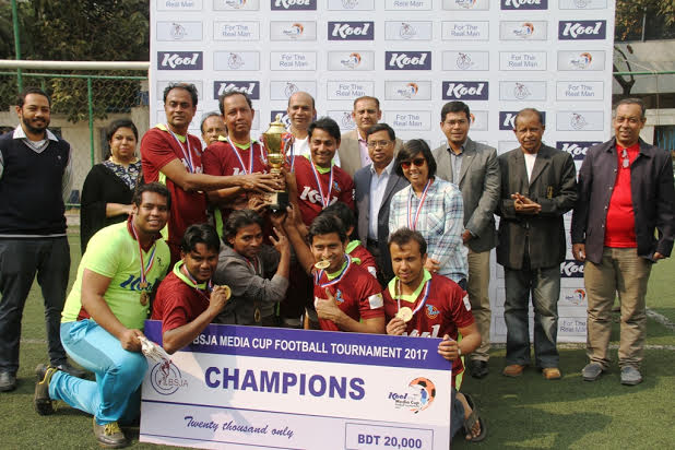 Members of Independent TV, the champions of the Kool-BSJA Media Cup Football with the chief guest Head of Marketing of Square Toiletries Limited Malik Md Sayeed and the other guests and officials of BSJA pose for a photo session at the BFF Artificial Turf