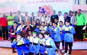 Members of BJMC, the champions of the EXIM Bank 27th National Women's Handball Championship with the chief guest Minister for Health and Family Welfare Mohammed Nasim and the officials of Bangladesh Handball Federation pose for a photo session at the Sha