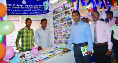 SYLHET: Shaheed Mustafa, UNO, South Surma Upazila visiting a stall of Islamic Foundation at the Development Fair on Tuesday.