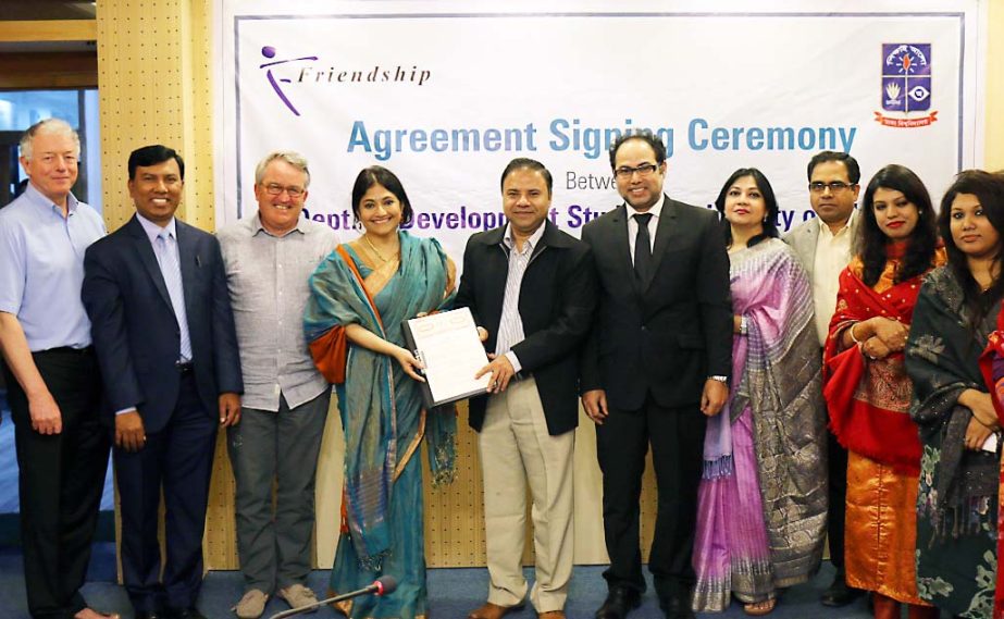 Dr Mohammad Abu Eusuf, Chairman of Department of Development Studies, University of Dhaka and Runa Khan, Founder and Executive Director of Friendship showing an agreement's copy recently signed between the institutions at the Asaaduzzaman Multipurpose Ro