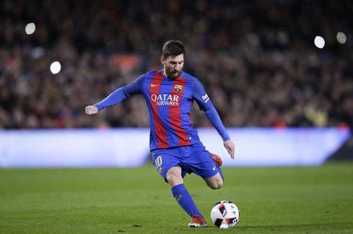 FC Barcelona's Lionel Messi kicks the ball to score during a Copa del Rey, 16 round, second leg, between FC Barcelona and Athletic Bilbao at the Camp Nou in Barcelona, Spain on Wednesday.