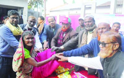 JAMALPUR:Winter clothes were distributed among the distressed people on behalf of the Daily Ittefaq and Atut, students' council of Rakhirpara University College on Thursday.