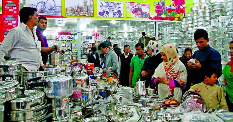 The picture shows huge gathering of visitors in a kitchen ware stall at DITF