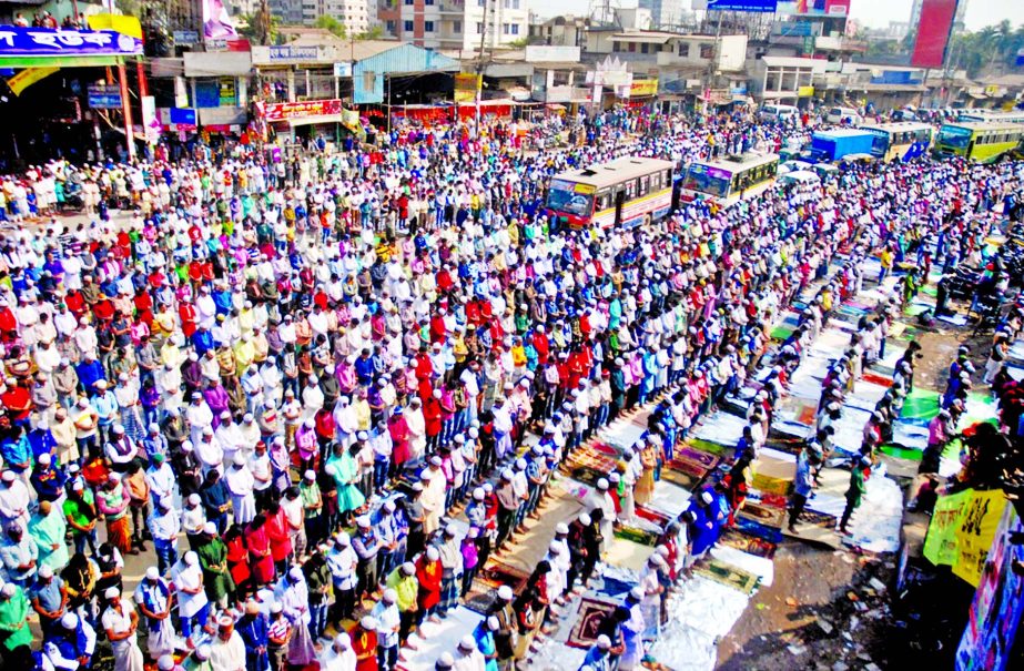 Devotees offer Jumma prayer on the first phase of the Bisma Ijtema ground on the bank of Turag River in Tongi.