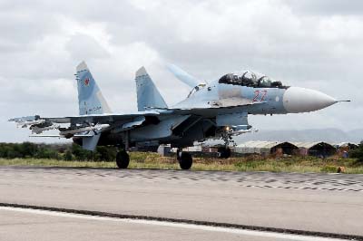 A Russian Sukhoi Su-35 bomber lands at the Russian Hmeimim military base in the northwest of Syria.