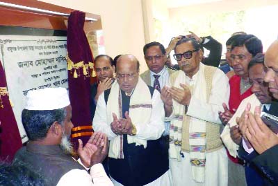 BABUGANJ (Barisal ): Health and Family Welfare Minister Md Nasim and Civil Aviation and Tourism Minister Rashed Khan Menon MP offering Munajat after inaugurating Mother and Child Care Centre at Babauganj Upazila Health Complex on Friday.