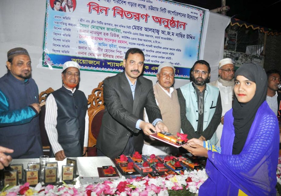 CCC Mayor A J M Nasir Uddin distributing prizes among the meritorious students at reception programme organised by Shamoli Abasik Area Kalyan Samity on Friday.