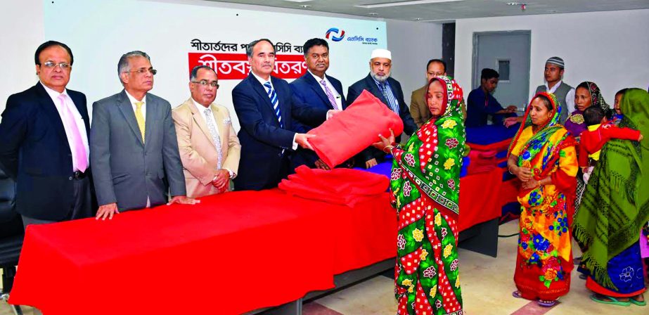 Golam Hafiz Ahmed, Managing Director and CEO of NCC Bank recently inaugurated a charitable blankets distribution programme in the city. Mosleh Uddin Ahmed, Additional Managing Director, Md. Fazlur Rahman, A Z M Saleh and Md. Habibur Rahman, Deputy Manag
