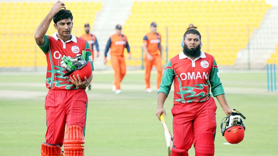 Naseem Khushi (l) and Khurram Nawaz (r) walk off after their 57-run stand during the Desert T20, Group B match between Netherlands and Oman at Abu Dhabi on Sunday.