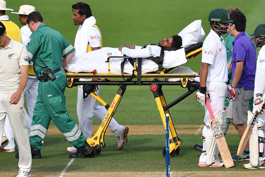 Imrul Kayes is stretchered off after hurting his hip during a dive after being hit on the 4th day of 1st Test between New Zealand and Bangladesh at Wellington on Sunday.