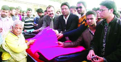 RANGPUR: Dr Shahjahan Mahmood, Chairman, Bangladesh Telecommunication Regulatory Commission distributing blankets among the cold-hit people at Ashratpur Chalkbazar City College ground as Chief Guest on Saturday.