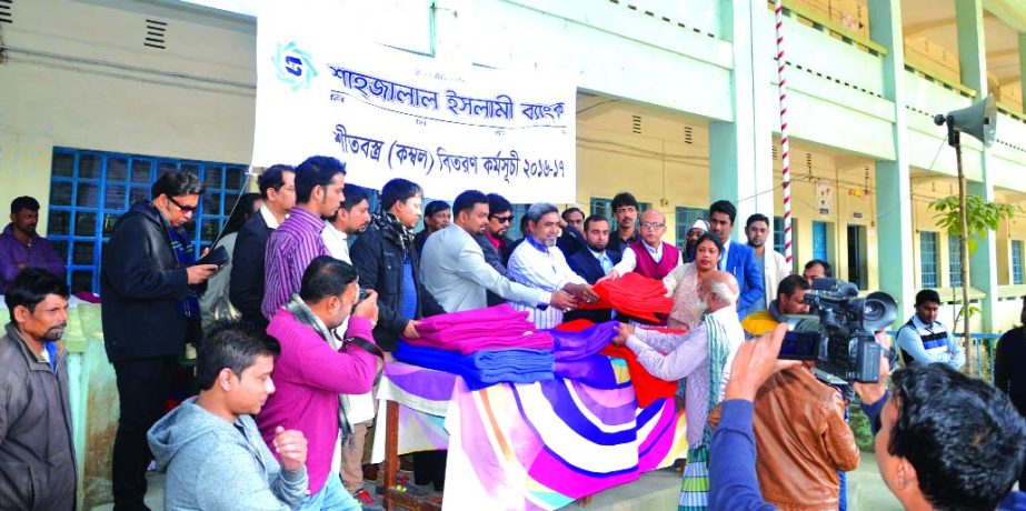 Shahjalal Islami Bank Ltd. distributed Blankets among the winter hit poor people at Nawabganj under Dhaka district recently. Razzak Mollah, prominent businessman and social worker, Patricia Celine Gomez and Md Abdul Mazid, Branch Managers were present in