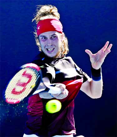 Slovakia's Lukas Lacko hits a forehand return to Spain's Albert Ramos-Violas during their first round match at the Australian Open tennis championships in Melbourne, Australia on Monday.
