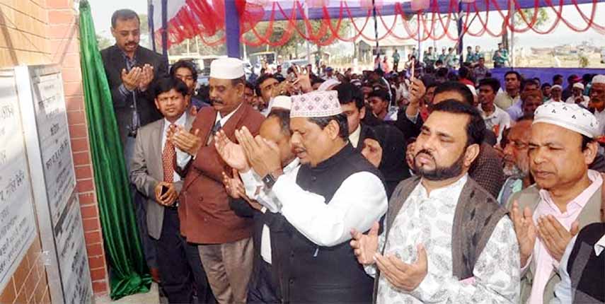 CCC Mayor AJM Nasir Uddin offering Munajat after inaugurating five Secondary Transfer Station (STS) for dumping the household wastes in the city on Monday.