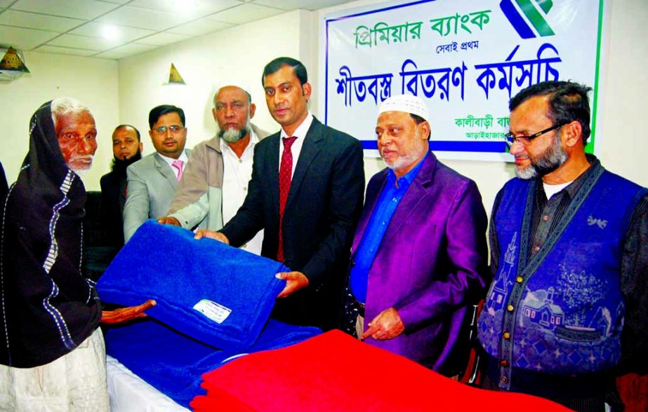 Golam Mawla, Branch Manager of Premier Bank Ltd, Kali Bazar Br distributing blankets among cold hit poor people of Arai Hazar Upazila on Tuesday. ABM Kamruzzaman Faruq, eminent businessman and freedom fighter, Md Nurul Huda, Billal Hossain, Ahmedul Kabir