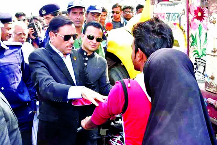 Road Transport and Bridges Minister Obaidul Quader at a campaign organised for road safety and mass awareness at Savar-Hemayetpur Bus Stand on Dhaka-Aricha highway on Tuesday.