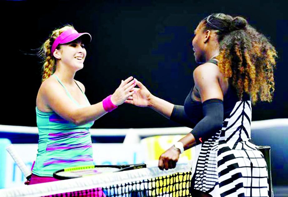 United States' Serena Williams, right, is congratulated by Switzerland's Belinda Bencic during their first round match at the Australian Open tennis championships in Melbourne, Australia on Tuesday.