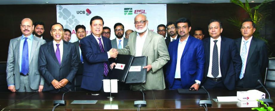 Muhammed Ali, Managing Director of United Commercial Bank Limited (UCB) and Abdul Fattah, Chairman of Express System Limited (ESL) exchanging documents after signing an agreement on Wednesday in the city. Under the agreement ESL will maintain payroll man