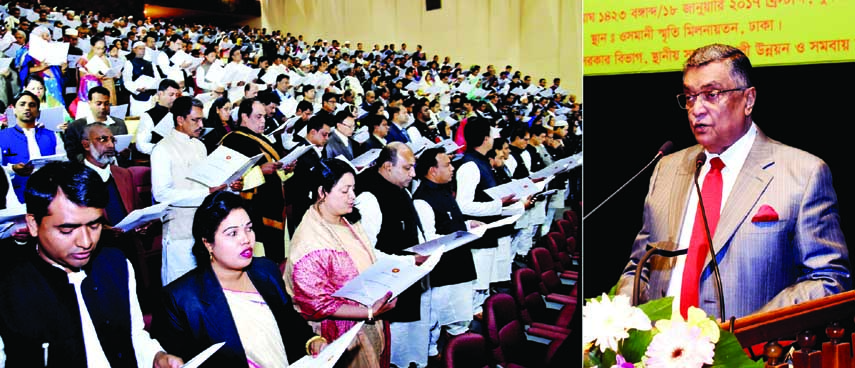 LGRD and Cooperatives Minister Engineer Khandaker Mosharraf Hossain administering the oath of the newly-elected members of district council at Osmani Memorial Auditorium in the city yesterday.