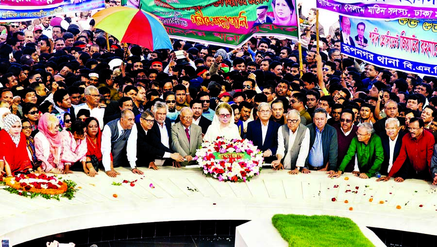 BNP Chairperson Begum Khaleda Zia along with party leaders and activists placing floral wreaths on the Mazar of Shaheed President Ziaur Rahman on Thursday marking the latter's 81st birth anniversary.