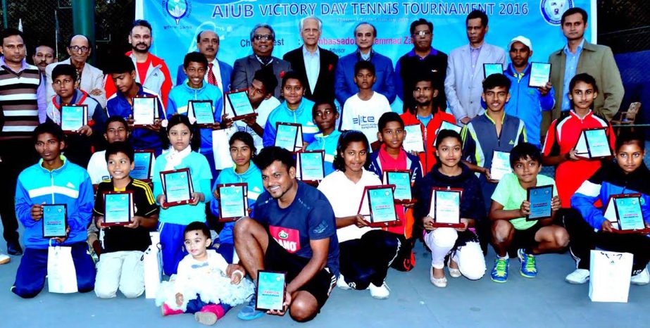 The winners of the AIUB Victory Day Tennis Tournament with the chief guest Dr Gowher Rizvi, Adviser to Prime Minister and the other guests and officials of Bangladesh Tennis Federation pose for a photo session at the National Tennis Complex in Ramna on Th