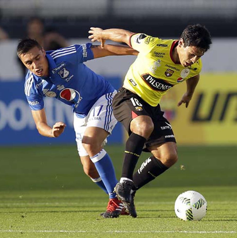 Millonarios FC's Henry Rojas, left, and Barcelona SC's Matian Oyola battle for possession of the ball during the first half of a Florida Cup soccer match in Orlando, Fla on Wednesday.