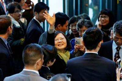 Taiwan President Tsai Ing-wen waves to supporters as she leaves a hotel for her return to Taiwan after her visit to Latin America in Burlingame, California.