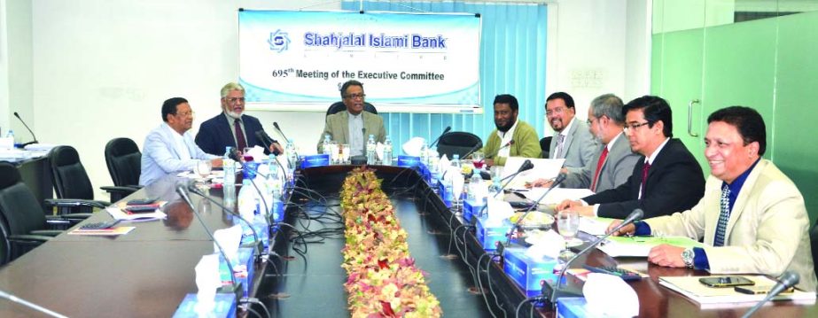 Fakir Akhtaruzzaman, Vice-Chairman of EC of Shahjalal Islami Bank Limited, presided over its 695th meeting at the bank's head office recently. Mohiuddin Ahmed, Vice-Chaiman of the Board of Directors, Akkas Uddin Mollah, Khandoker Sakib Ahmed, Directors,