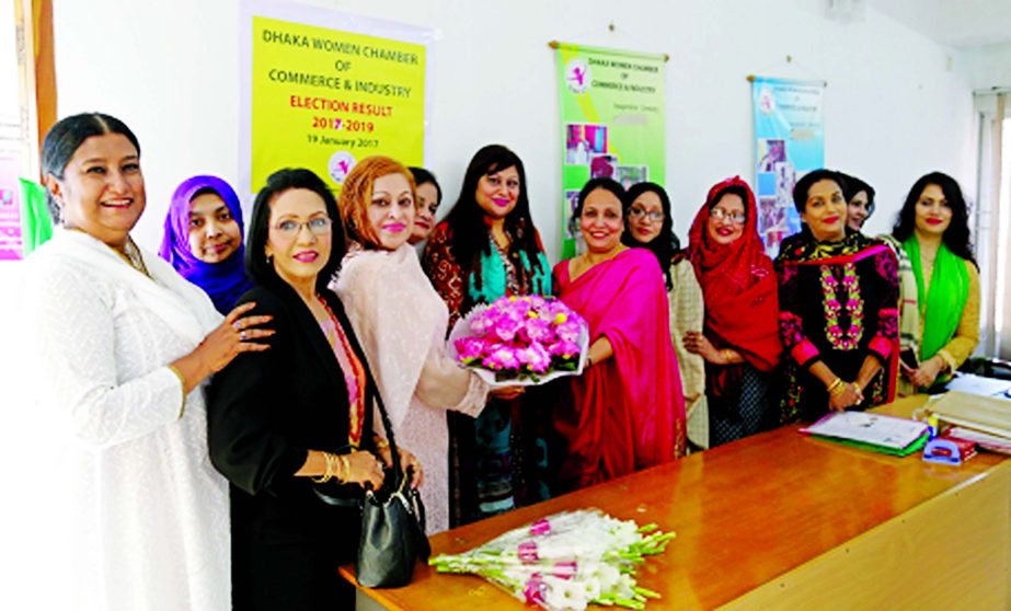 Naaz Farhana Ahmed, Founder President of Dhaka Women Chamber of Commerce & Industry (DWCCI) welcomed its new elected President Aneeka Agha with flowers at the Chamber Bhaban in the city recently. Nafisa Akbar, Vice President, Razia Kashem, 2nd Vice Presid