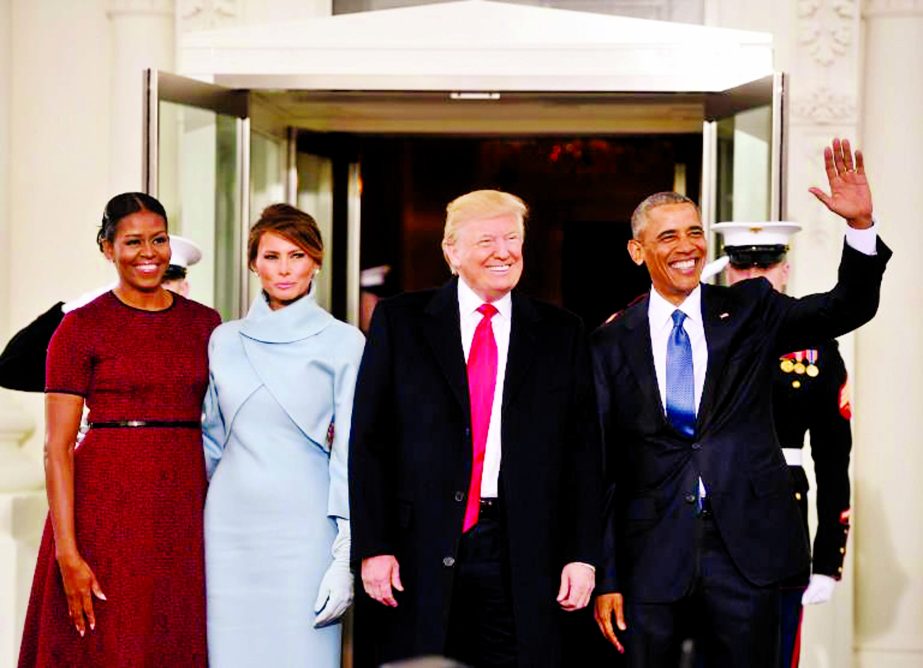 US President Barack Obama, right and First Lady Michelle Obama, left, welcome President-elect Donald J. Trump and his wife Melania to the White House in Washington on Friday.