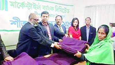 SHAKHIPUR (Tangail ): Anupom Shahjahan Joy MP distributing blankets among the cold- hit people in Sakhipur Upazila donated by Mercantile Bank Ltd, Sakhipur Branch on Thuirsday.