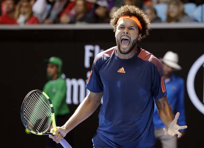 France's Jo-Wilfried Tsonga yells out while playing United States' Jack Sock during their third round match at the Australian Open tennis championships in Melbourne, Australia on Friday