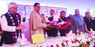 TRISHAL(Mymensingh): Public Administration Minister and Presidium Member of Bangladesh Awami League Syed Ashraful Islam is being greeted by A B M Anisuzzaman, Mayor, Trishal Pourashava at the golden jubilee of Trishal Nazrul Girls' High School on Satur