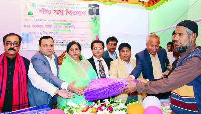 NARAYANGANJ: Adv. Hosnera Ara MP, Member of Standing Committee of Defense Ministry distributing winter clothes among the cold hit people of Fatullah area organised by Rahman Group as Chief Guest on Friday.