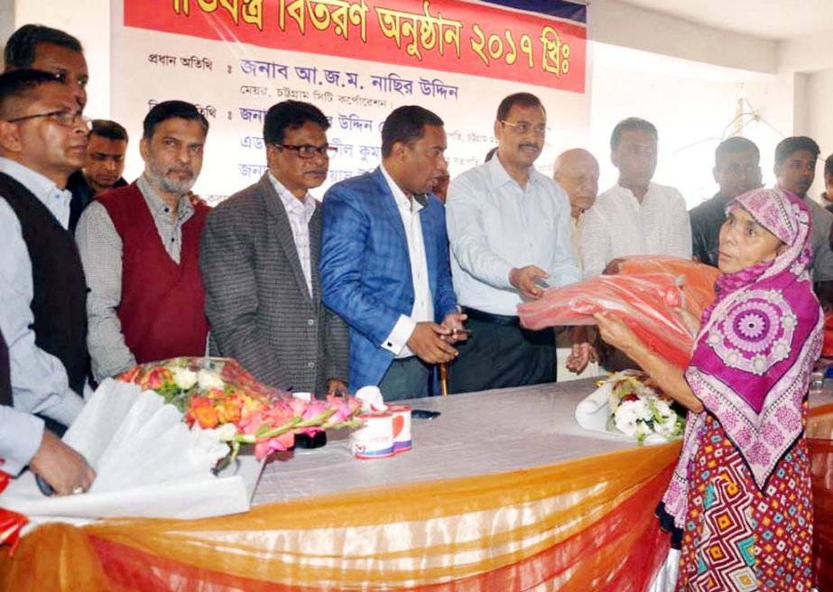 CCC Mayor A J M Nasir Uddin distributing winter clothes among the cold-hit people at Baghmonirampur Ward organised by Soft Motor Vehicles Driver- Union Labour Membersâ€™ Forum as Chief Guest on Saturday.